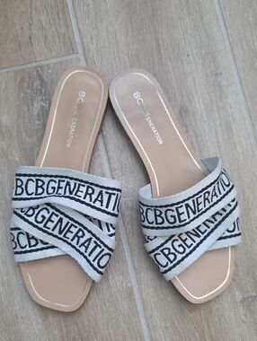 BCBGeneration Beige Slide Sandals with White and Black Logo Straps